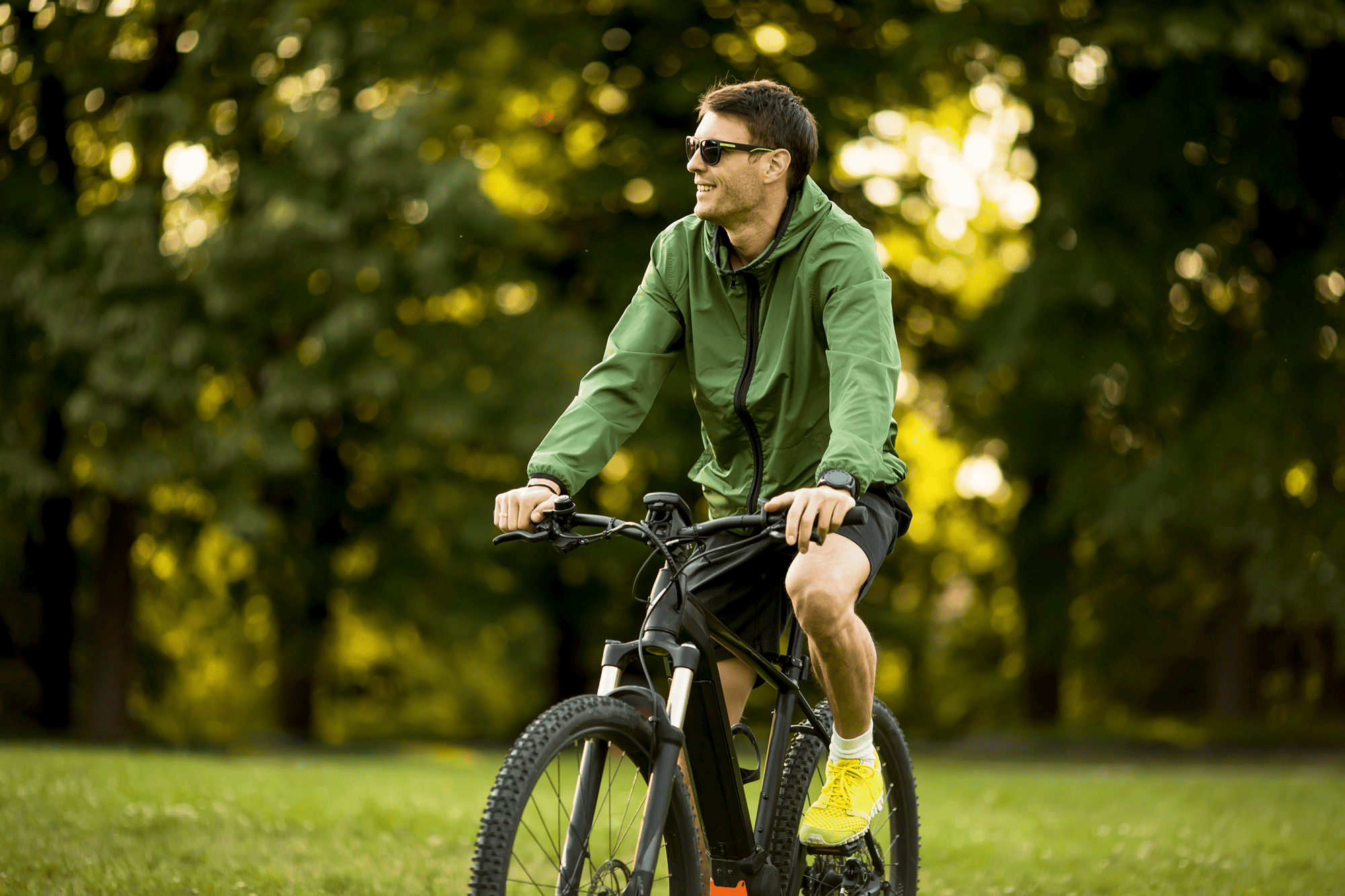 Cyclist on bike in park